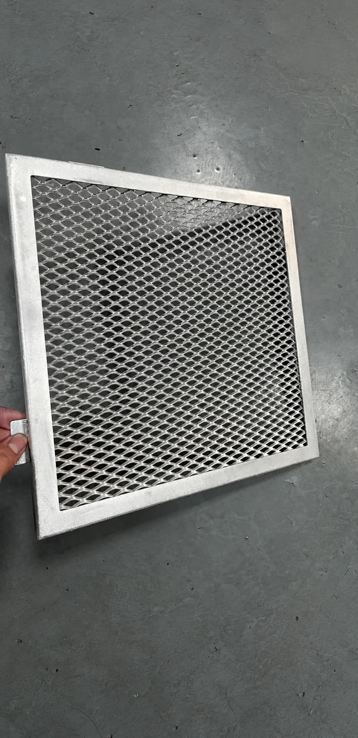 Close view of a framed expanded metal panel